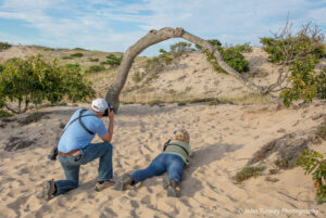 two people photographing dunes