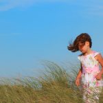 girl in beach grass