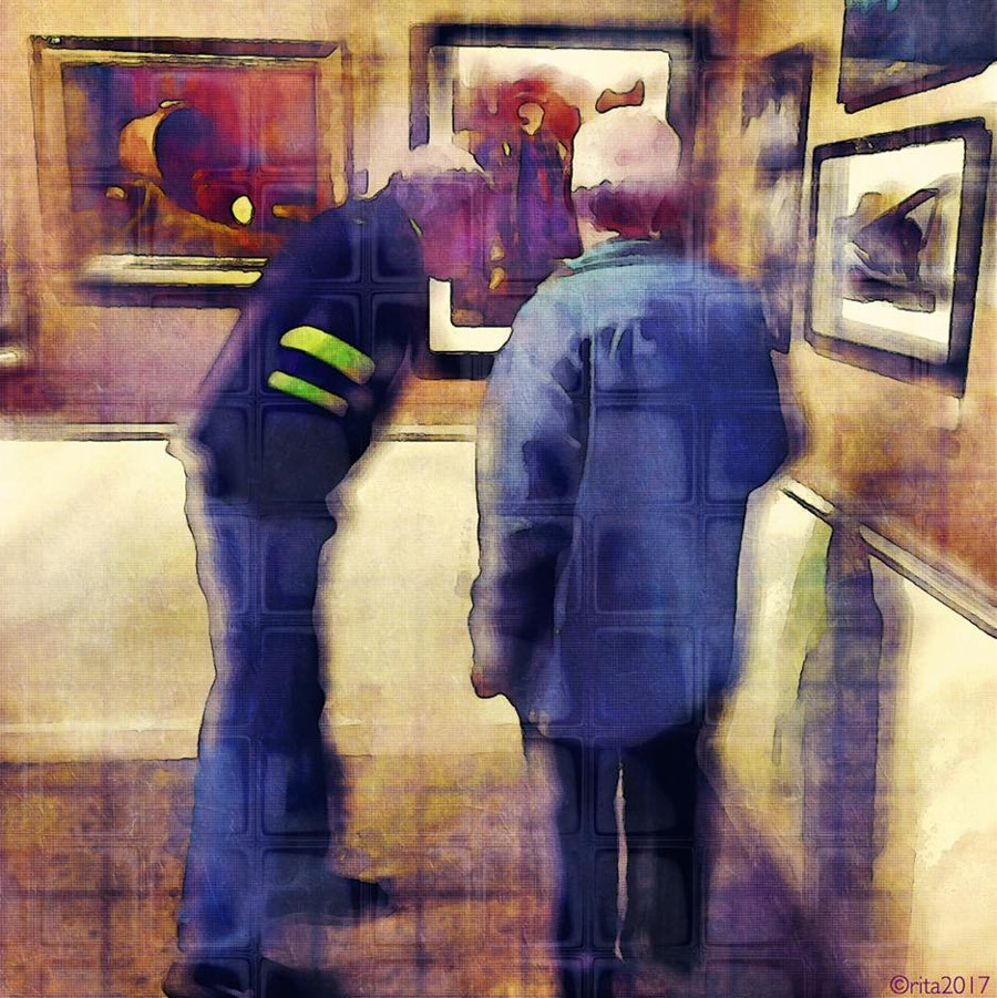 Two men looking at art exhibition