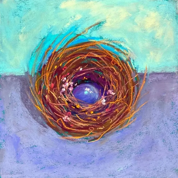 Colorful nest with a blue egg