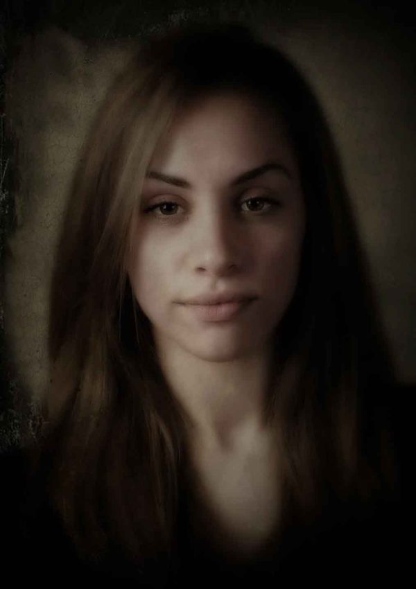 Soft portrait of woman in low light