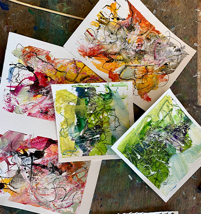 about-010 Abstract paintings on a wooden table.